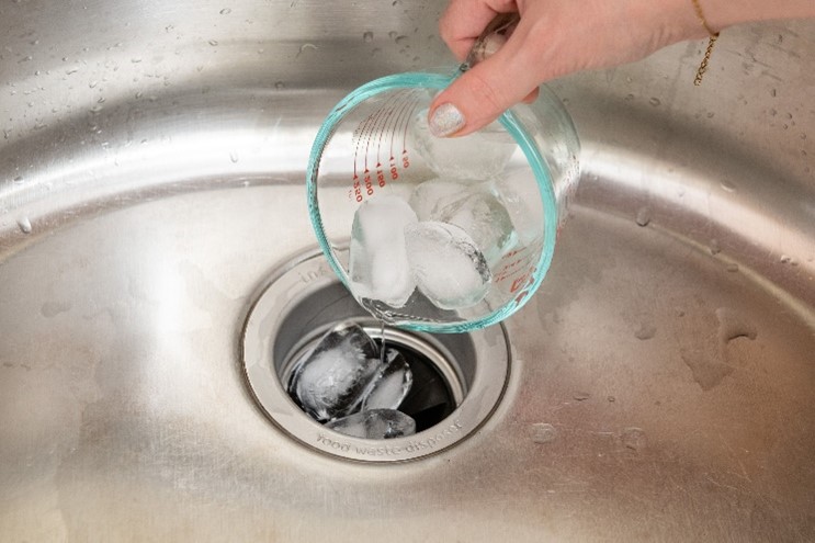 how to clean kitchen disposal with ice