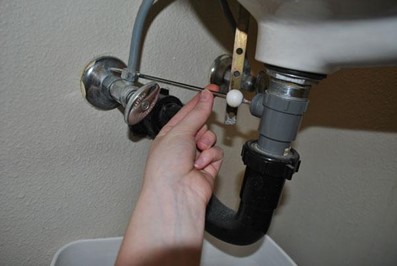 pivot rod being used for a clogged sink drain bathroom